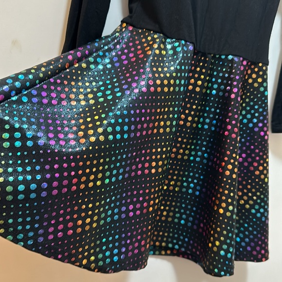 Pixie lane dress has black on top and flared rainbow sparkle on bottom. Size 2/3 - Picture 2 of 5